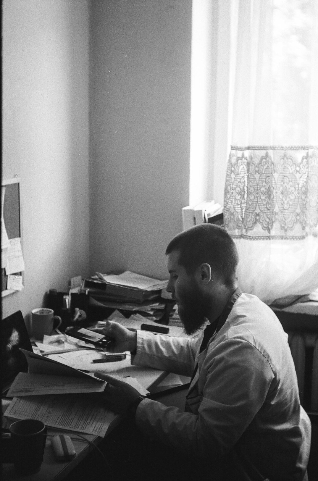 writer at desk with manuscript